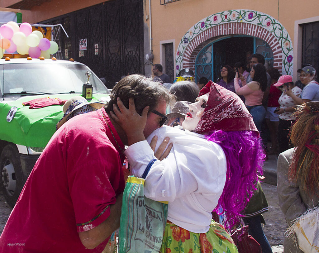 The ‘flour festival’ in Ajijic, Mexico, is a highlight of Carnival leading up to Lent. This picture shows the famous Sayacos, a man dressed in mask and pulling a mans head down into his flour coated bosom.