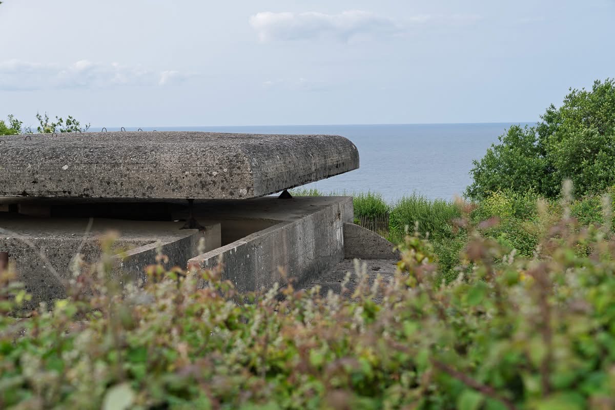 Two-story fire control bunker at Longues-sur-Mer on the anniversary of D-Day.