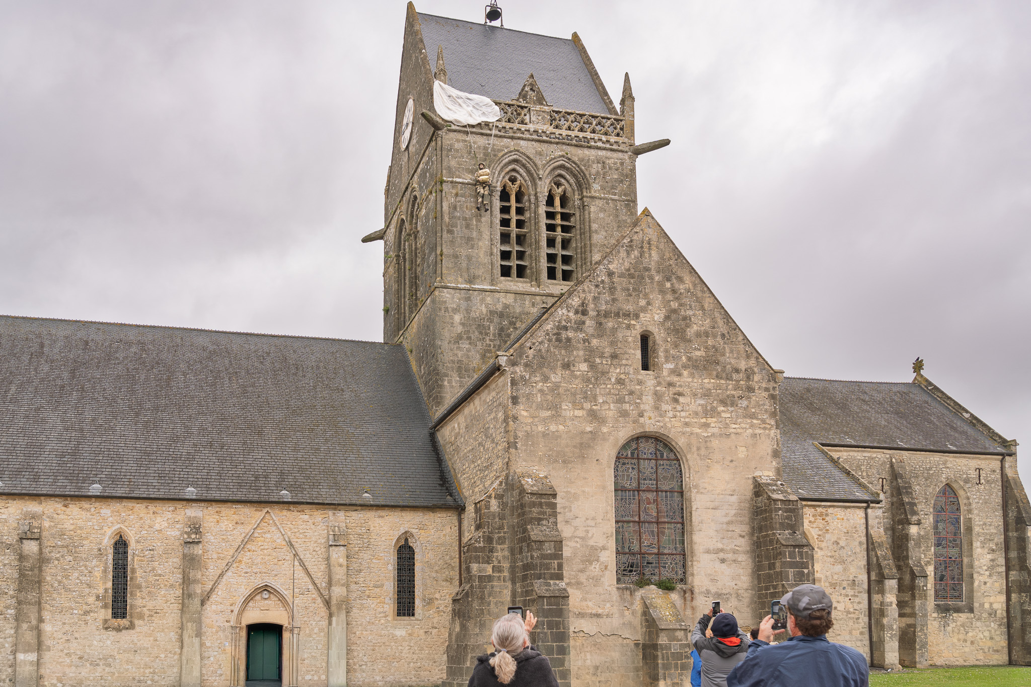 Effigy of Pvt. John Steele hanging on the pinnacle at Notre-Dame-de-l'Assomption church