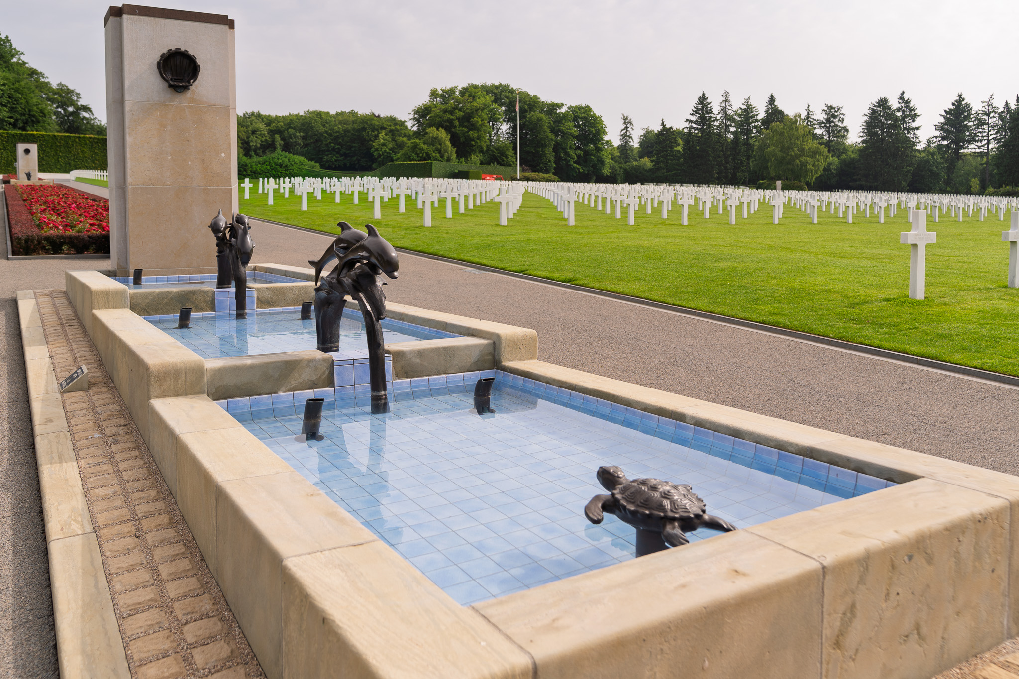 Bronze dolphins and turtles decorate pools at Luxembourg American Cemetery represent resurrection and everlasting life.