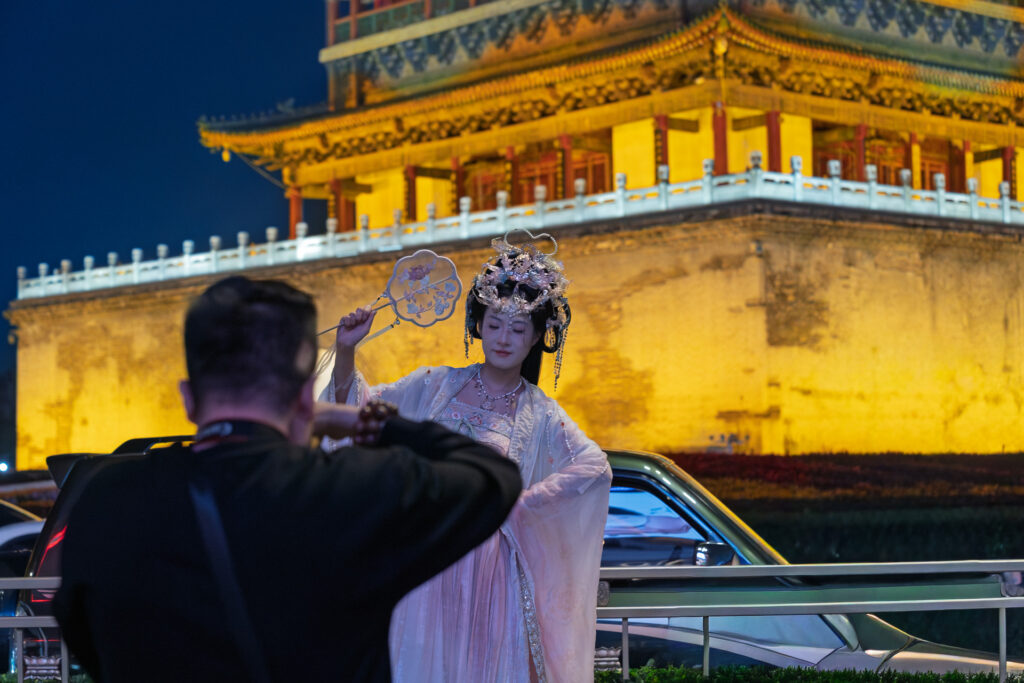 Girl in Hanfu at the Bell Tower in Xi'an with a Photographer