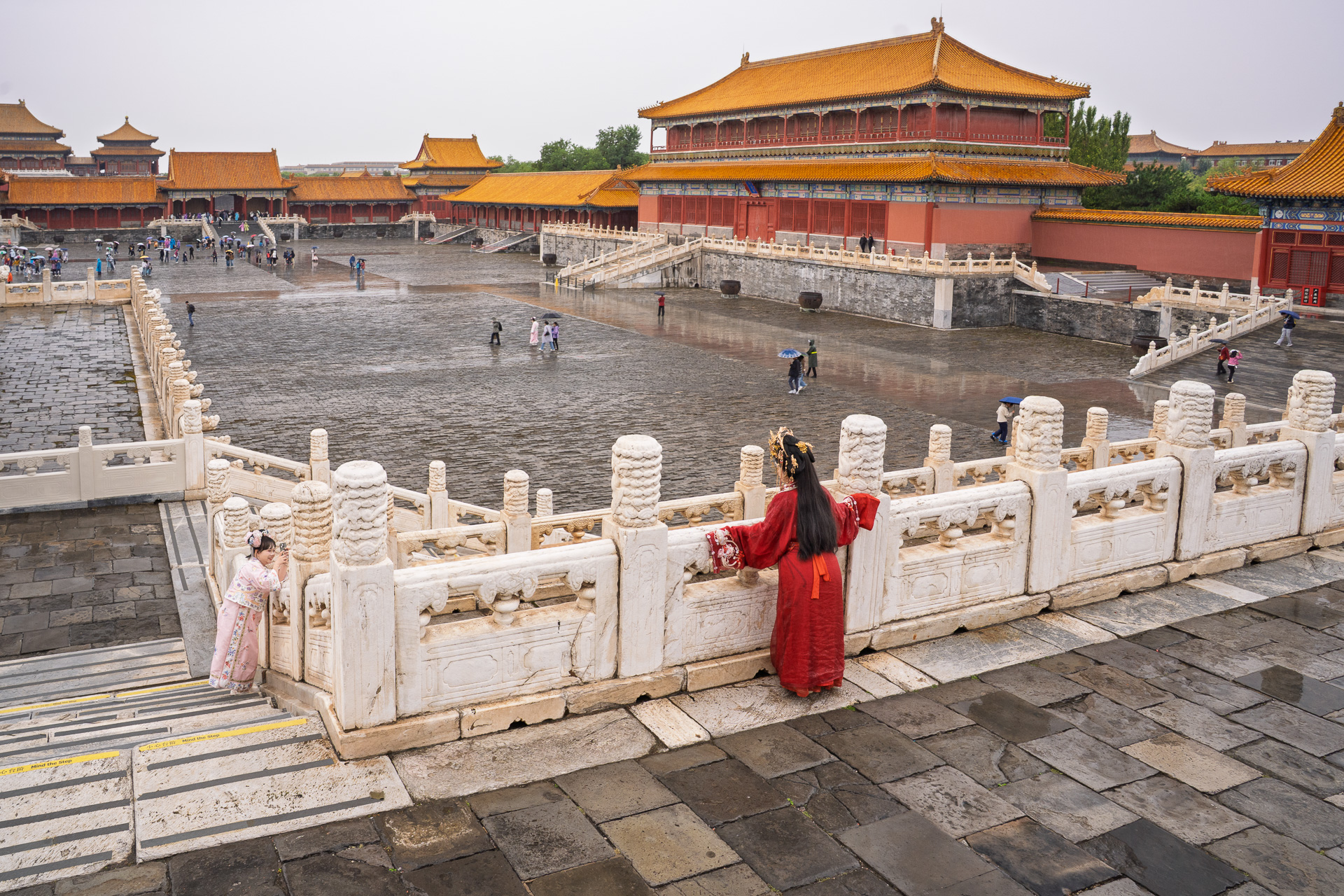 Girls in Hanfu taking pictures inside the Forbidden Palace