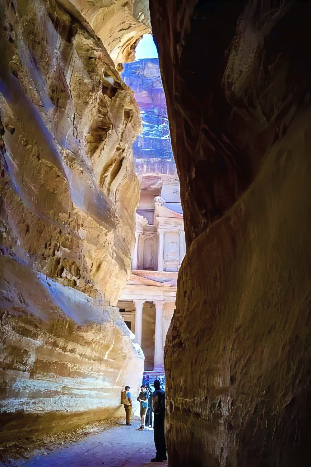 On the expedition to Jordan, we are walking through the Siq at petra and the the Treasury is coming into view between the limestone walls.