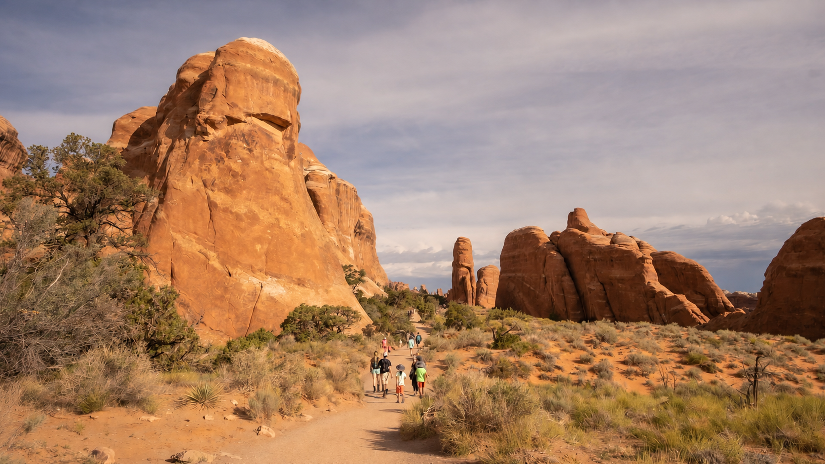 Arches National Park Pathway to landscape Arch with a large boulder on the left and in the distance.